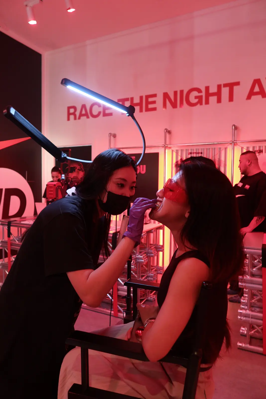 Curing light on a placement, the client holding her phone