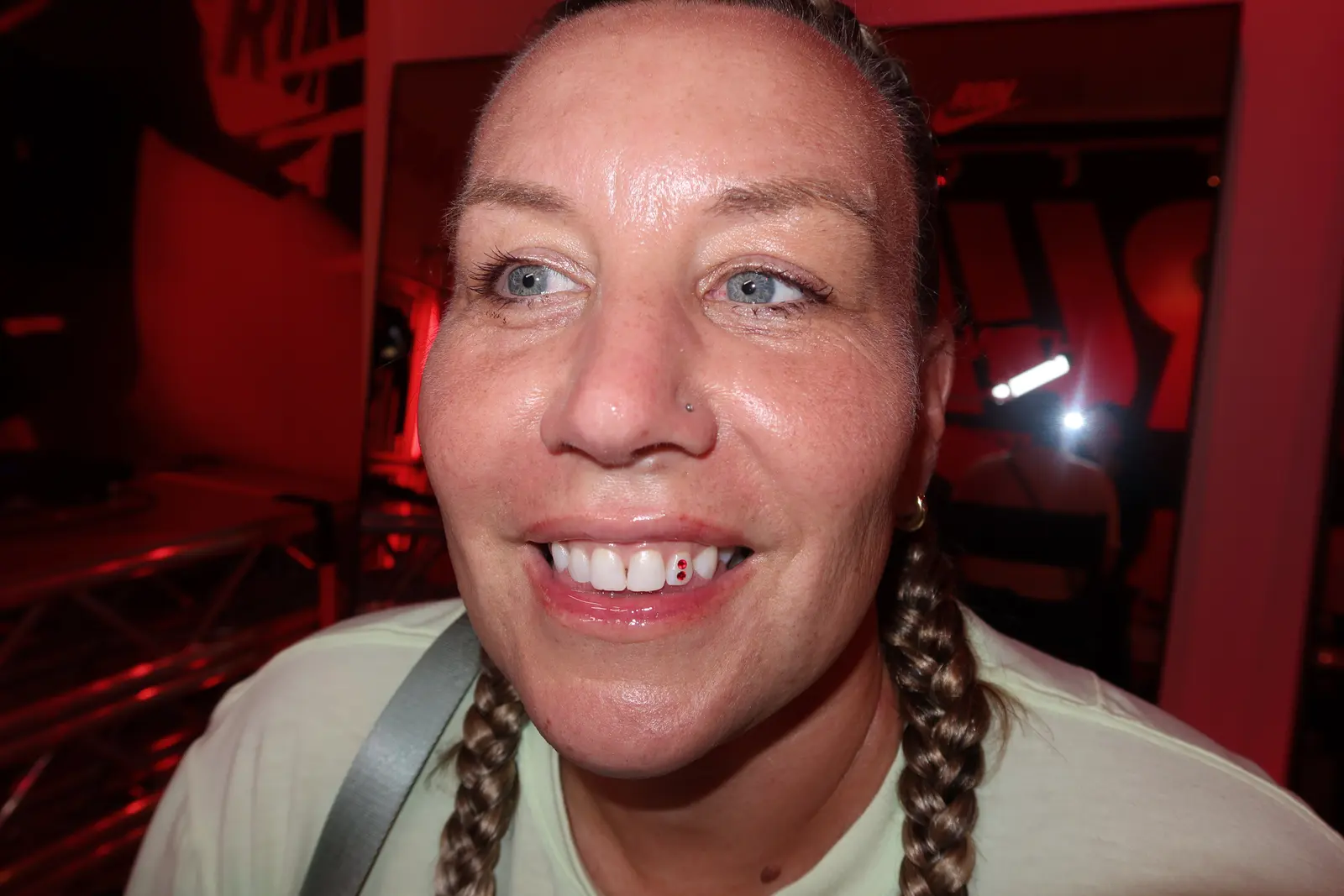 A client with braids showing her gem