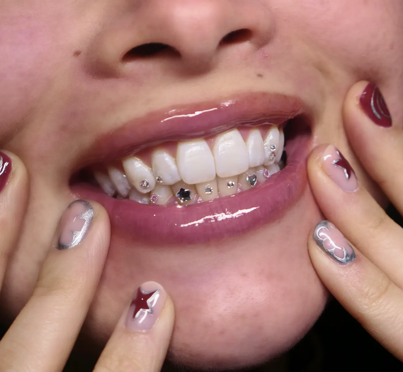 A dainty tooth gem set on a natural smile.